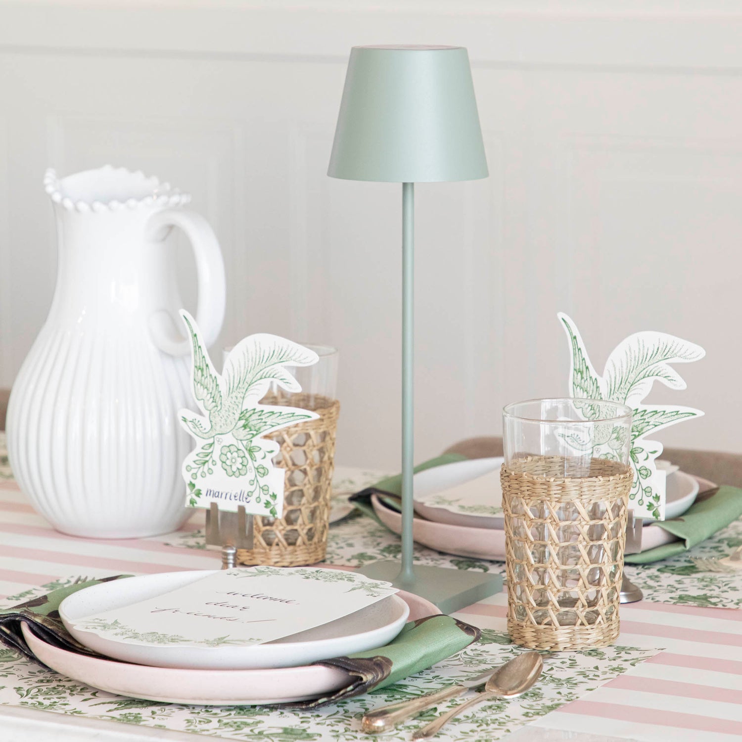 A table setting with place settings and a Zafferano Sage Cordless Lamp.