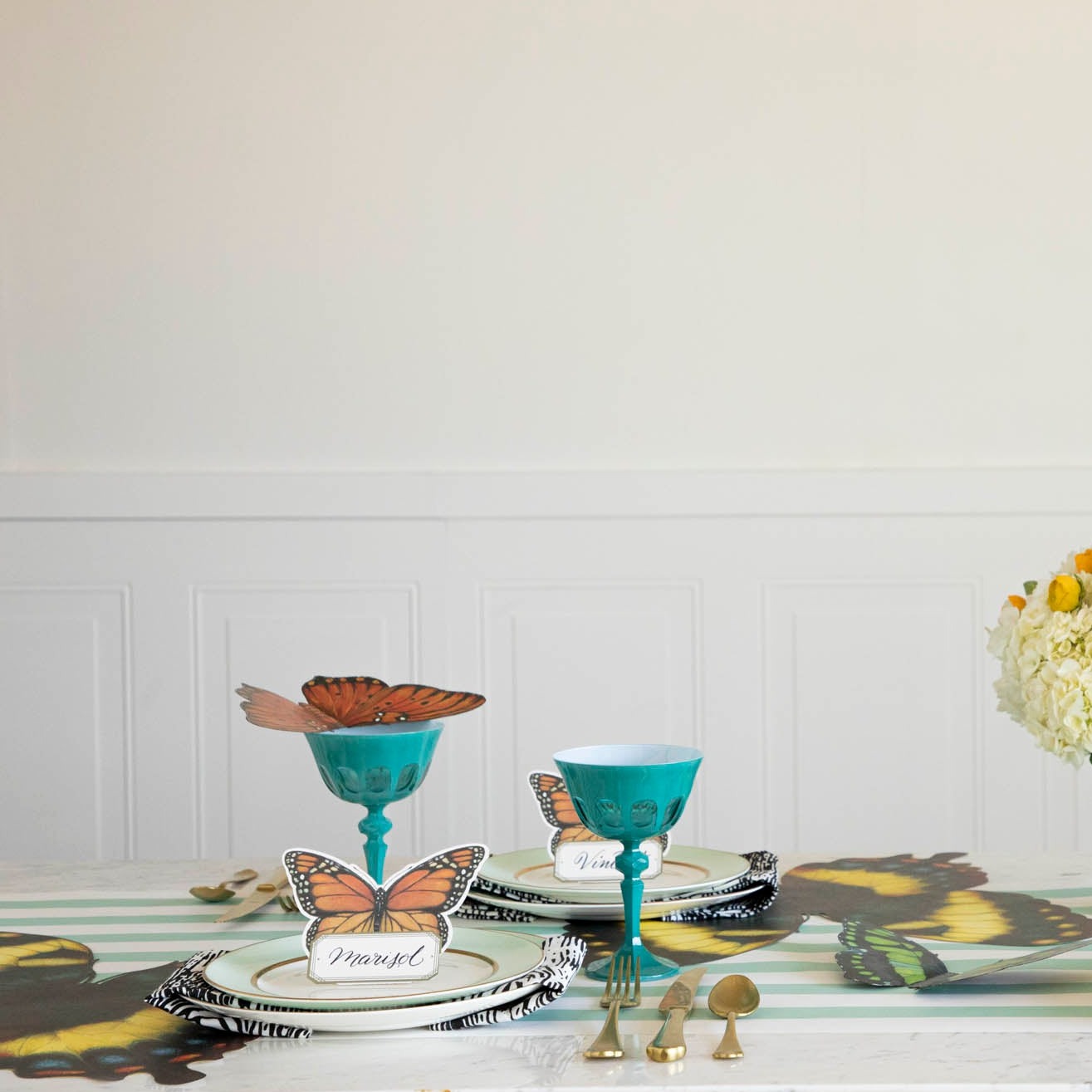 A butterfly-themed tablescape featuring all three Butterfly Table Accents scattered amongst the decor.