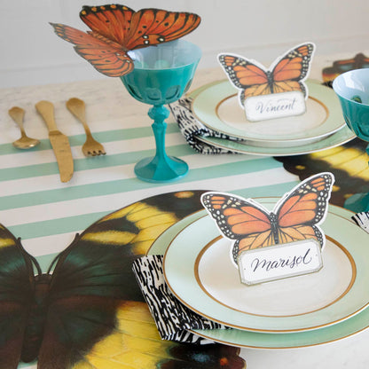 An elegant butterfly-themed table setting featuring Die-cut Butterfly Placemats at each place. 