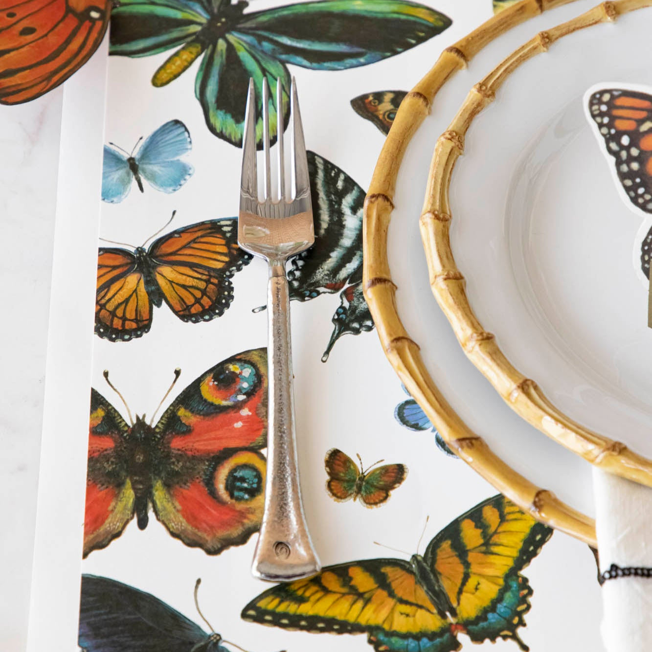 A variety of colorful butterflies displayed against a light background on Hester &amp; Cook&