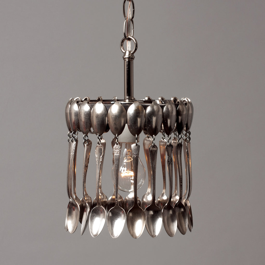 A hand-crafted Spoon Pendant Light made of vintage spoons hanging from a chain by Hester &amp; Cook.