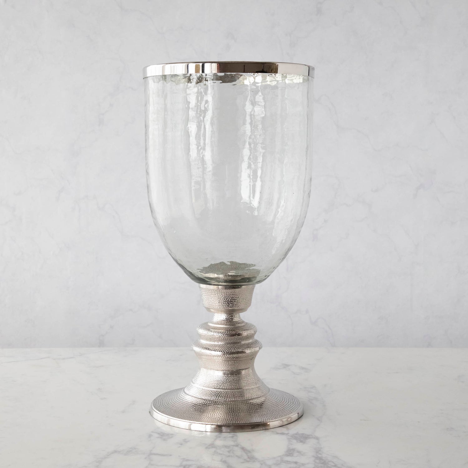A 12.5&quot; Candle Hurricane Holder on a marble table.