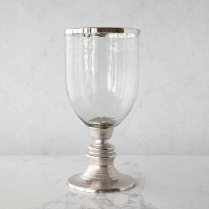 A 12.5&quot; Candle Hurricane Holder on a marble table.