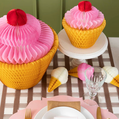 Medium and Large Honeycomb Cupcakes behind a place setting.