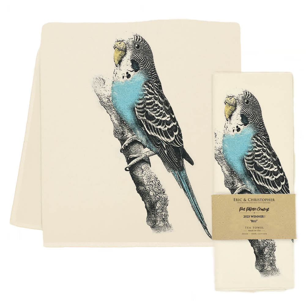 A high-quality fabric kitchen towel with a blue parakeet on it, the Eric &amp; Christopher Blu Tea Towel.