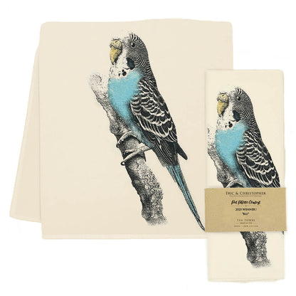 A high-quality fabric kitchen towel with a blue parakeet on it, the Eric &amp; Christopher Blu Tea Towel.