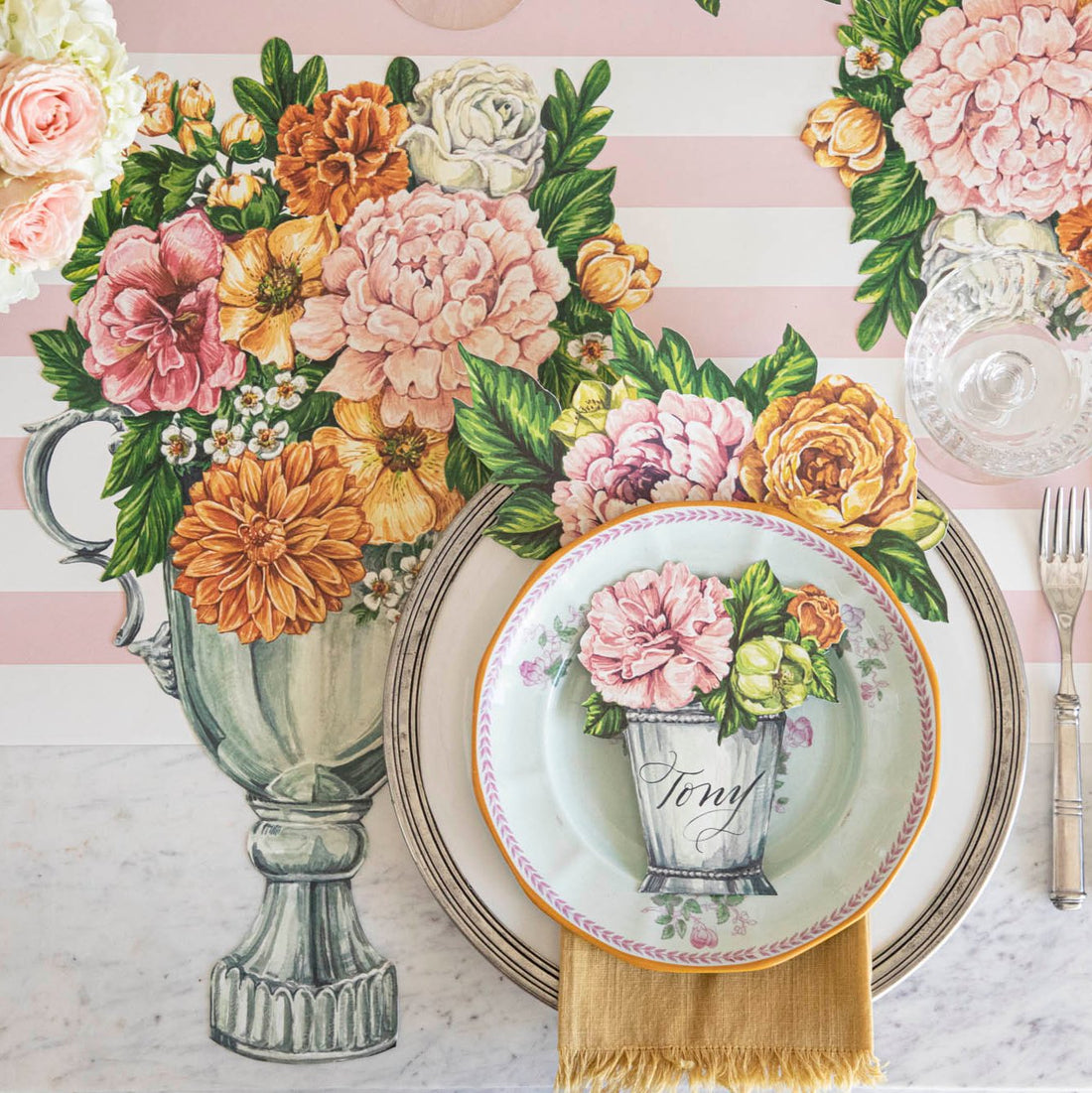 The Die-cut Garden Trophy Placemat under an elegant floral table setting, from above.