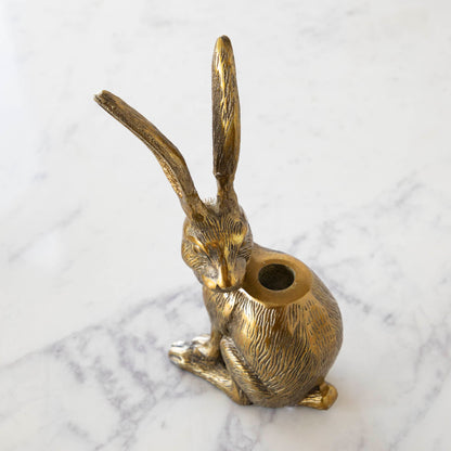 Halcyon Hare Taper Candleholders by Accent Decor on a wooden board.