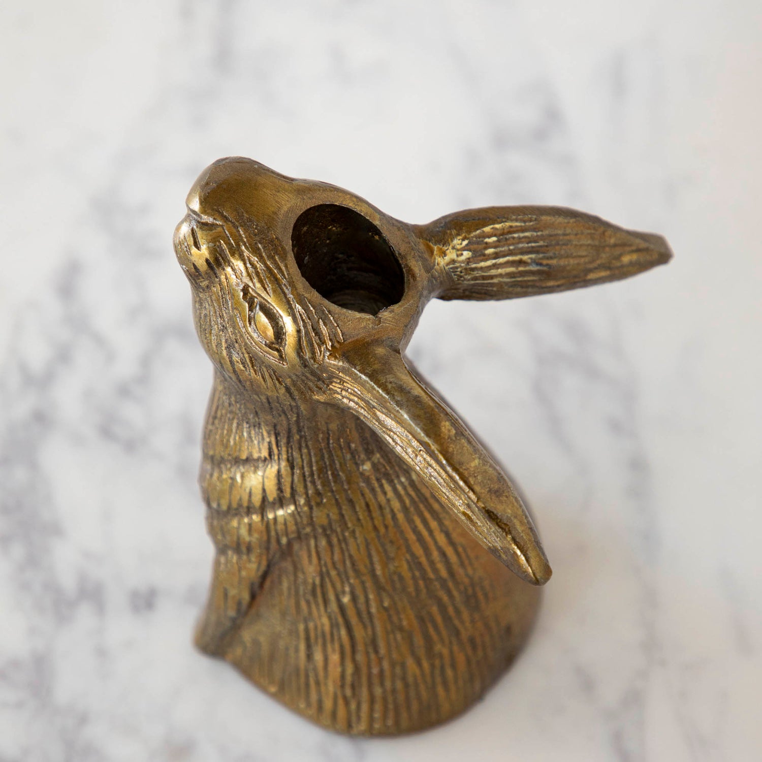 Halcyon Hare Taper Candleholders by Accent Decor on a wooden board.