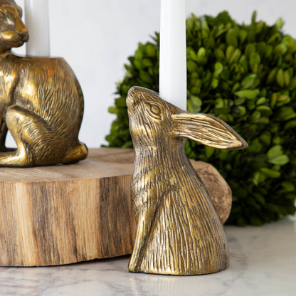 Halcyon Hare Head Taper Candleholder with a candle sticking out of its head between the ears.
