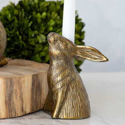 Halcyon Hare Head Taper Candleholder with a candle sticking out of its head between the ears.