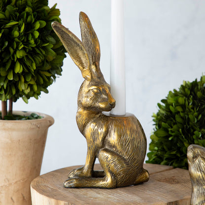 Halcyon Hare Taper Candleholders by Accent Decor on a wooden board.