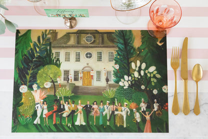 A High Kick Placemat resting on a table with no plate on it, showing the festive artwork, from above.