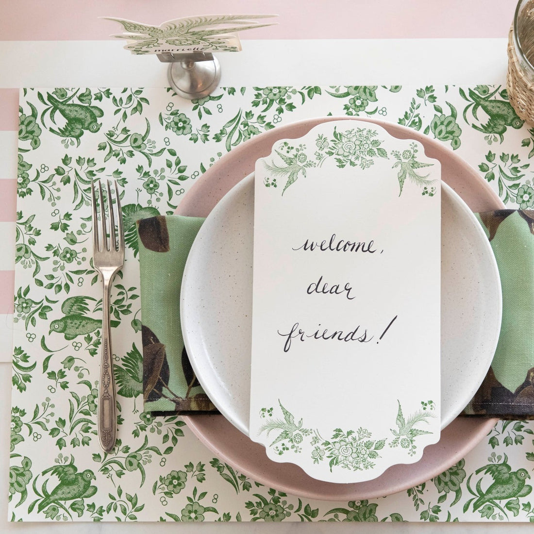 The Green Regal Peacock Placemat under an elegant place setting, from above.