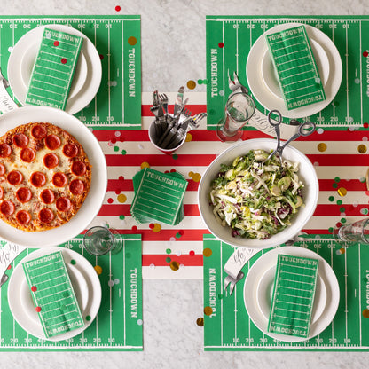 A sports themed table setting for four featuring the Touchdown Placemat and Touchdown Napkins.