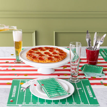 A sports themed table setting with the Touchdown Placemat on the Red Classic Stripe Runner.