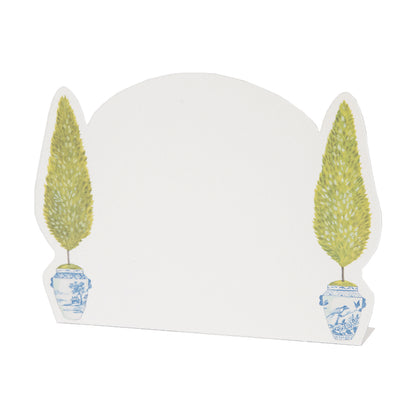 A white Hester &amp; Cook Topiary place card with two potted trees on it.