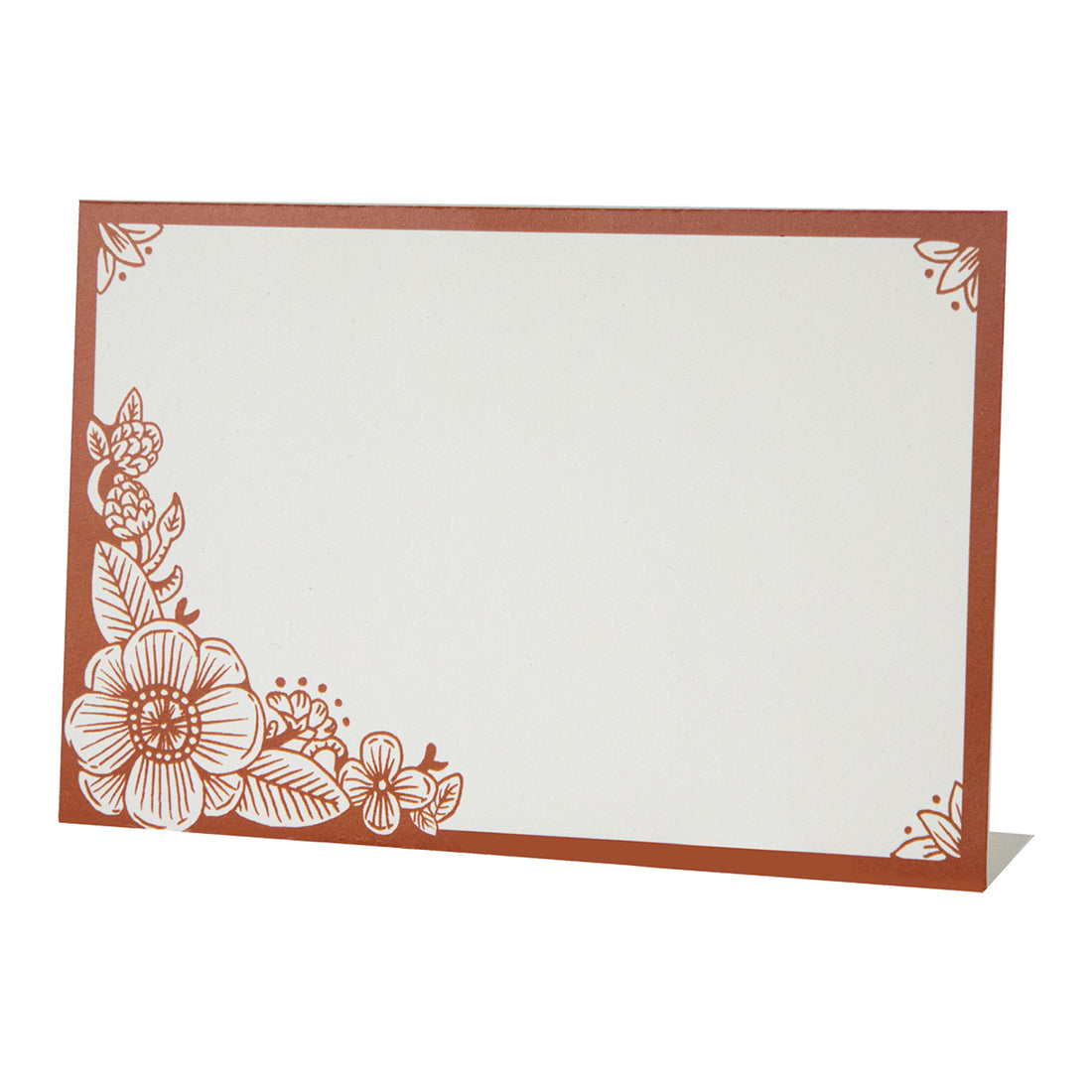 A free-standing, rectangular white table card with a dark orange frame around the edges, embellished with dark orange linework flower designs in the corners.