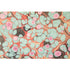 An abstract, marbled pattern consisting of bubbles of seafoam, pink and dark grey, over a swirled background of red and gold.