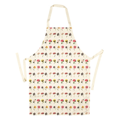 A linen apron patterned with illustrated tiny people holding gigantic vibrant blooms by the stems, in pink, yellow, red and purple. 
