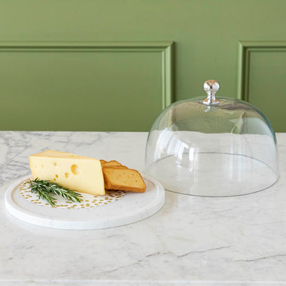 Chocolate muffins under a Bidk Home Marble &amp; Glass Food Dome with Knob, 11.5&quot; Diameter, presented on a white marble plate.