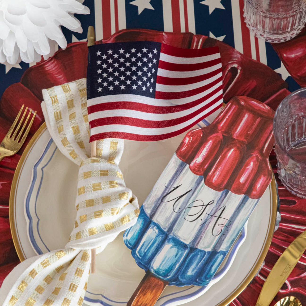 Close-up of a patriotic place setting featuring the Die-cut Star-Spangled Placemat.
