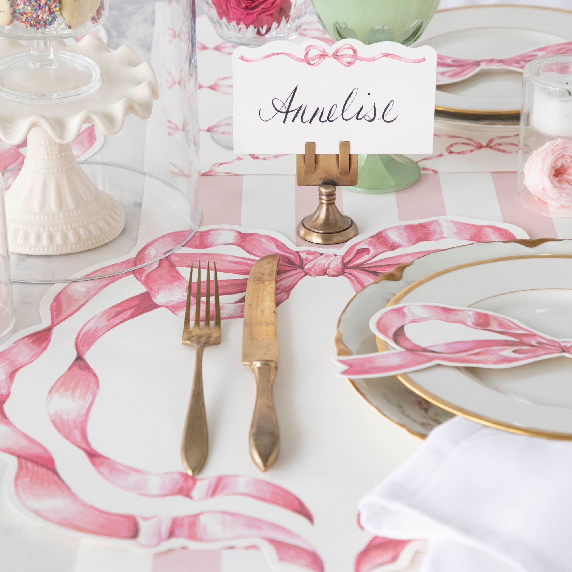 A table with dishes and silverware adorned with Hester &amp; Cook&