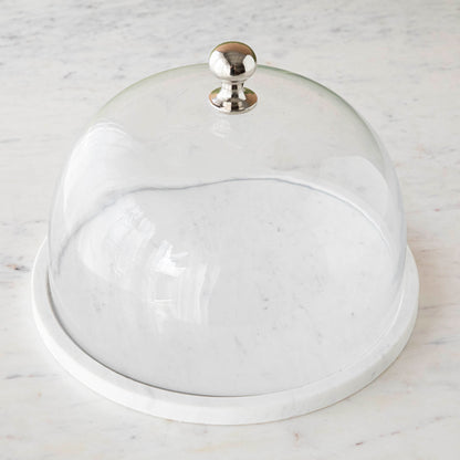 Chocolate muffins under a Bidk Home Marble &amp; Glass Food Dome with Knob, 11.5&quot; Diameter, presented on a white marble plate.