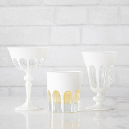 Three Rialto Chalk (White) Glasses by SIR/MADAM on a Venice-styled white brick wall.