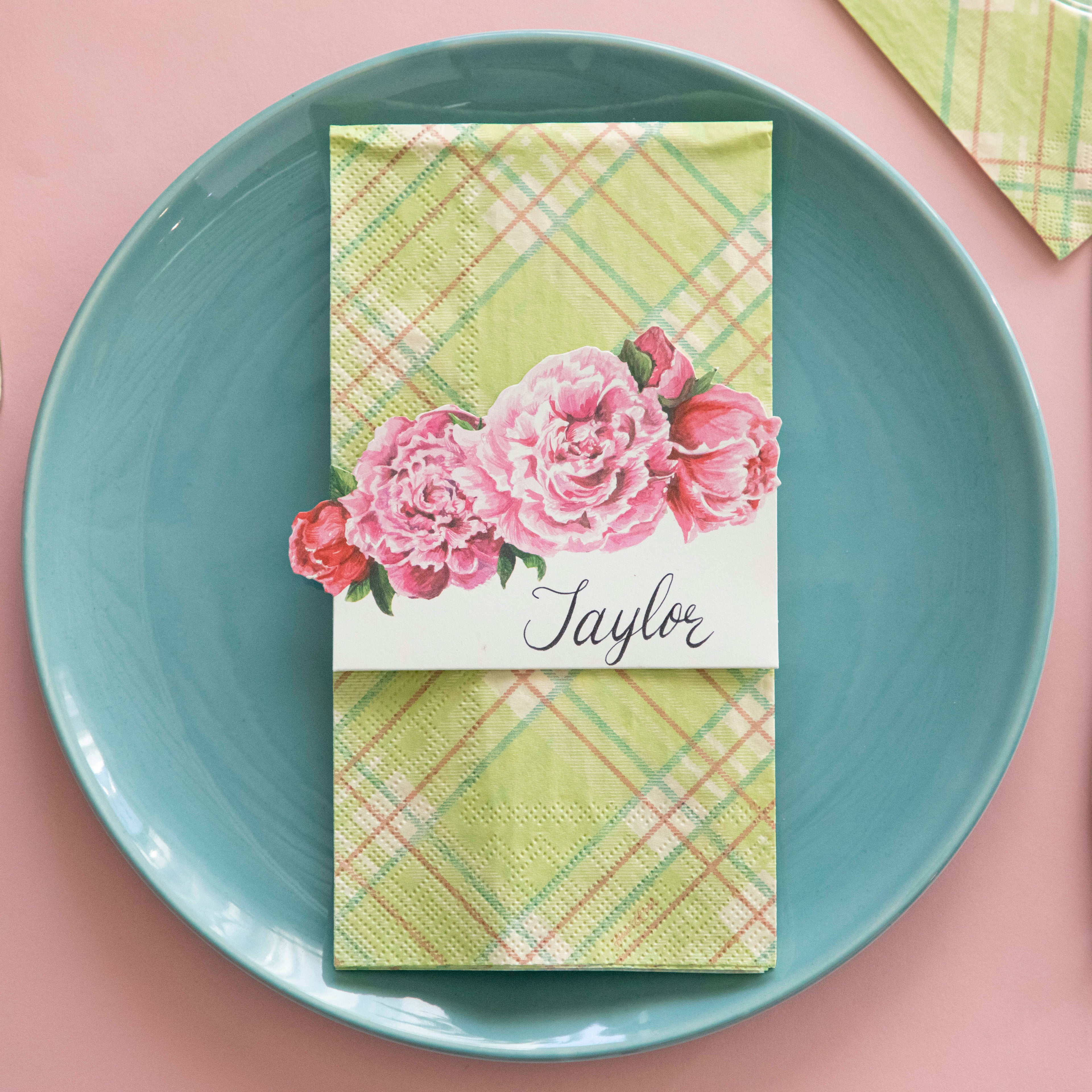 Bright Green Plaid Guest Napkin on a plate with the Peony Place Card on top.