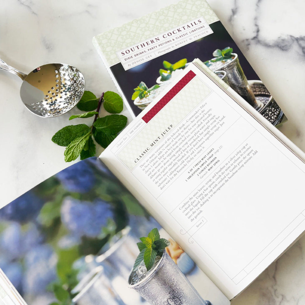 A Chronicle Books book cover titled &quot;Southern Cocktails&quot; featuring an image of four mint julep drinks on a silver tray, perfectly capturing the spirit of cocktail hour.