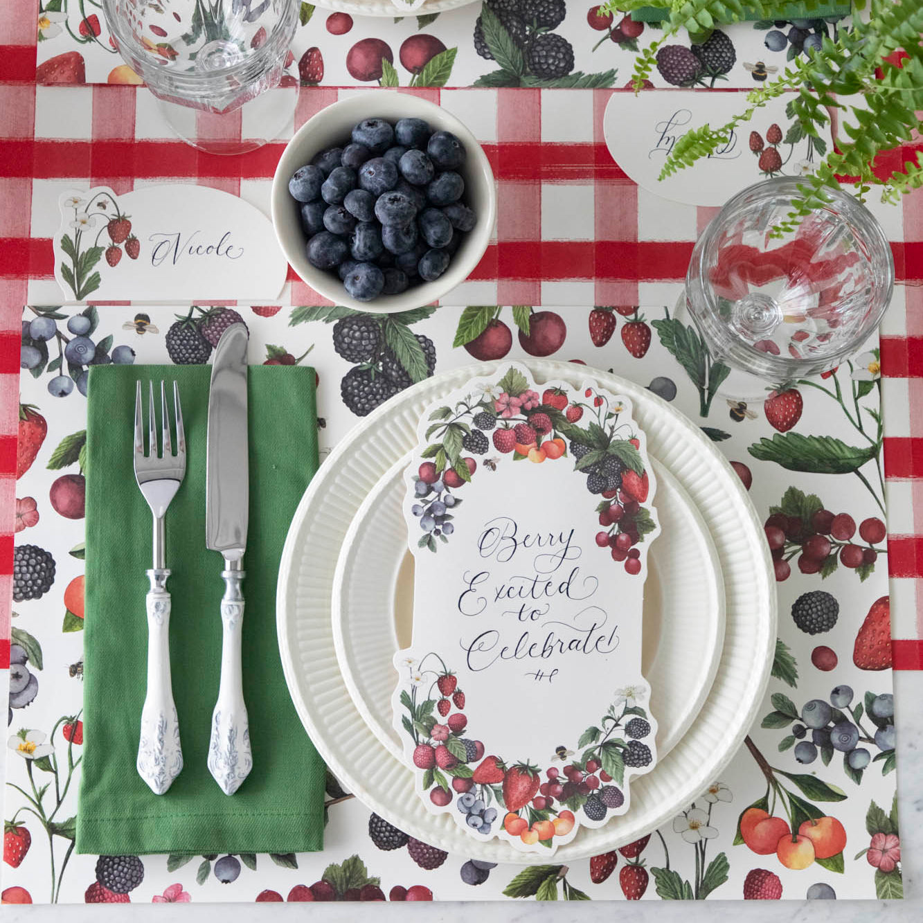 The Wild Berry Placemat under an elegant summertime table setting, from above.