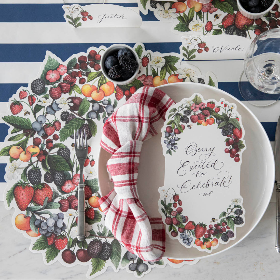 The Die-cut Berry Wreath Placemat under an elegant place setting, from above.