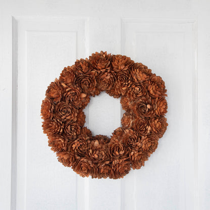 Sunset Shola Almond Flower Wreath hanging on door