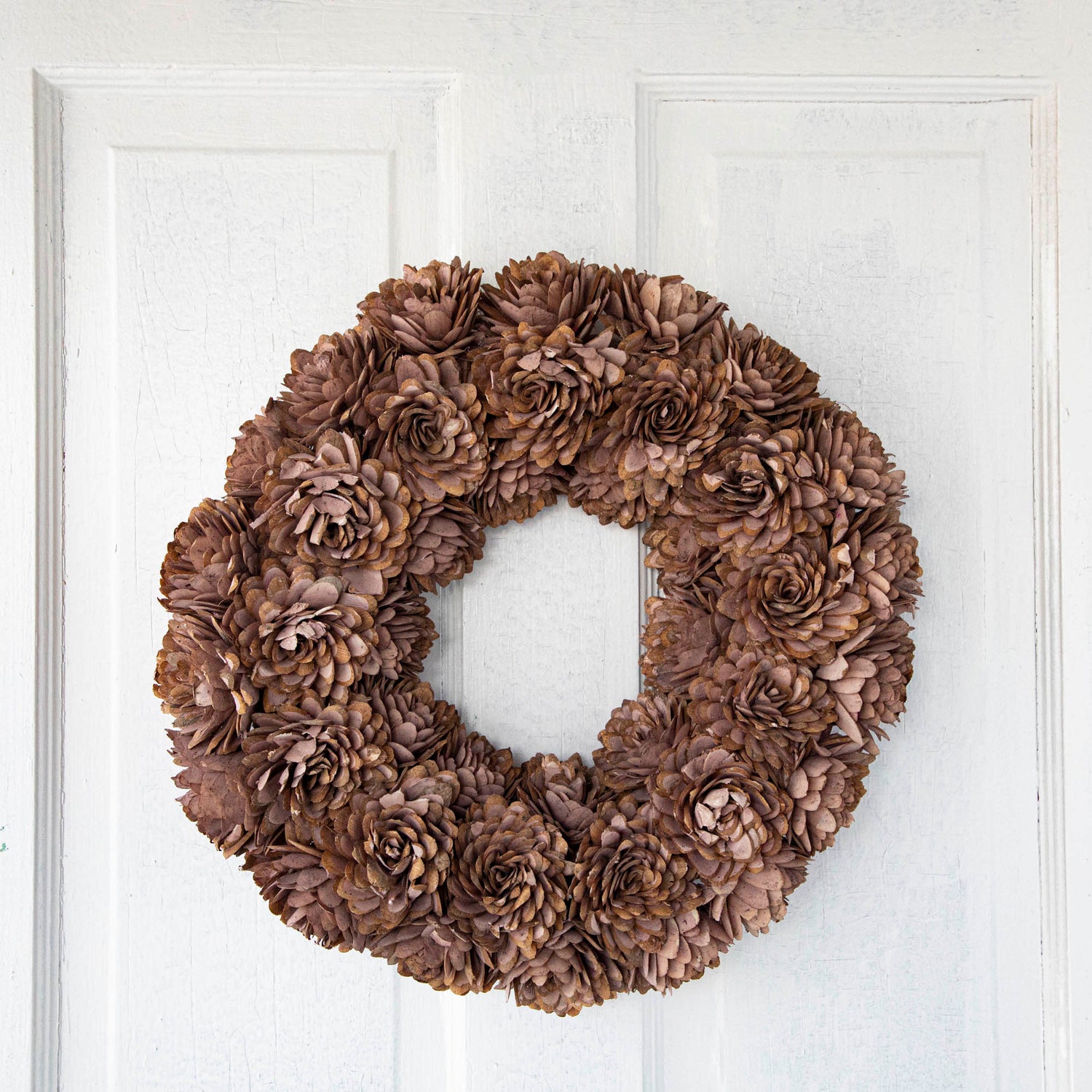 Blush Shola Almond Flower Wreath hanging on door