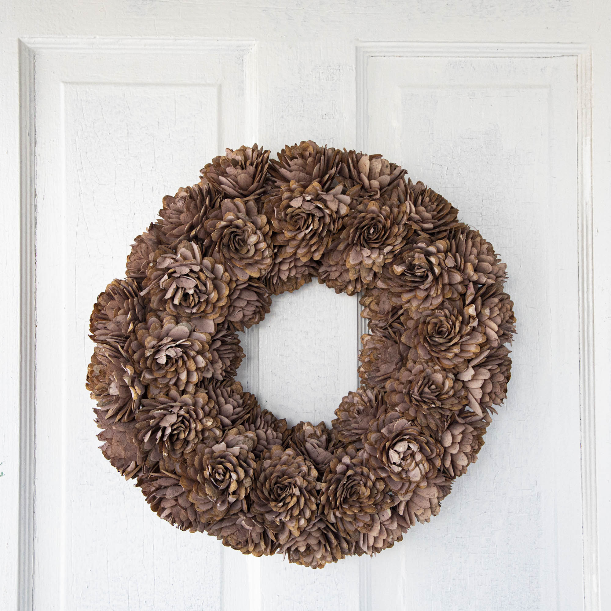 Blush Shola Almond Flower Wreath hanging on door