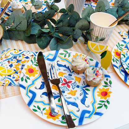 La Dolce Vita Paper Plate setting with cupcakes on it. 