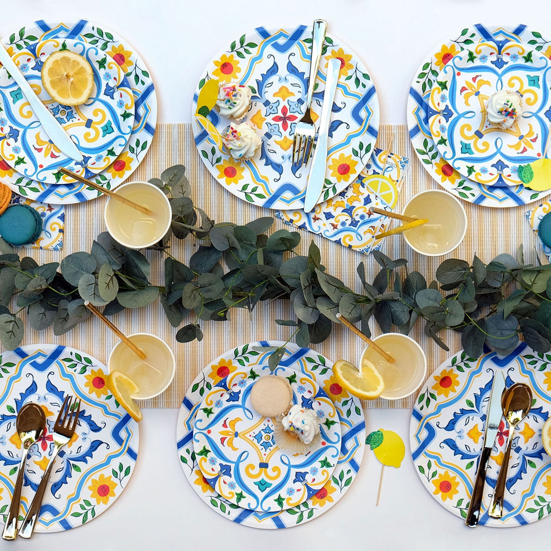 La Dolce Vita Paper Plates settings with cupcakes on them. 