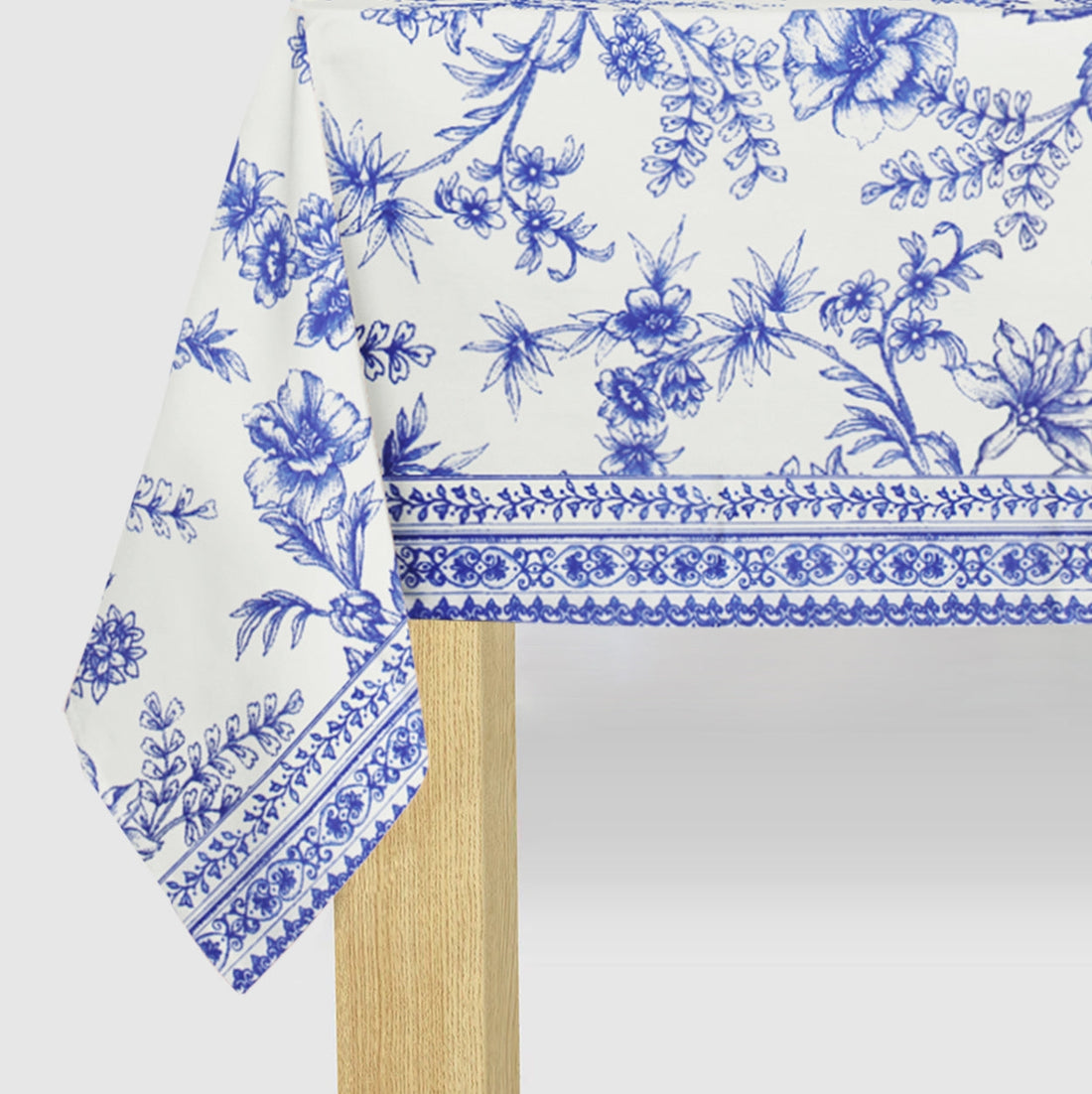Blue French Toile Paper Tablecloth on a table.