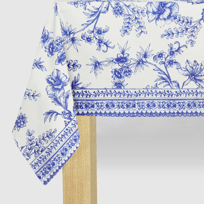 Blue French Toile Paper Tablecloth on a table.