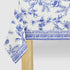Blue French Toile Paper Tablecloth on a table.