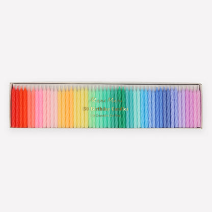 A set of Rainbow Twisted Mini Candles by Meri Meri in a box, perfect for a celebratory party theme.