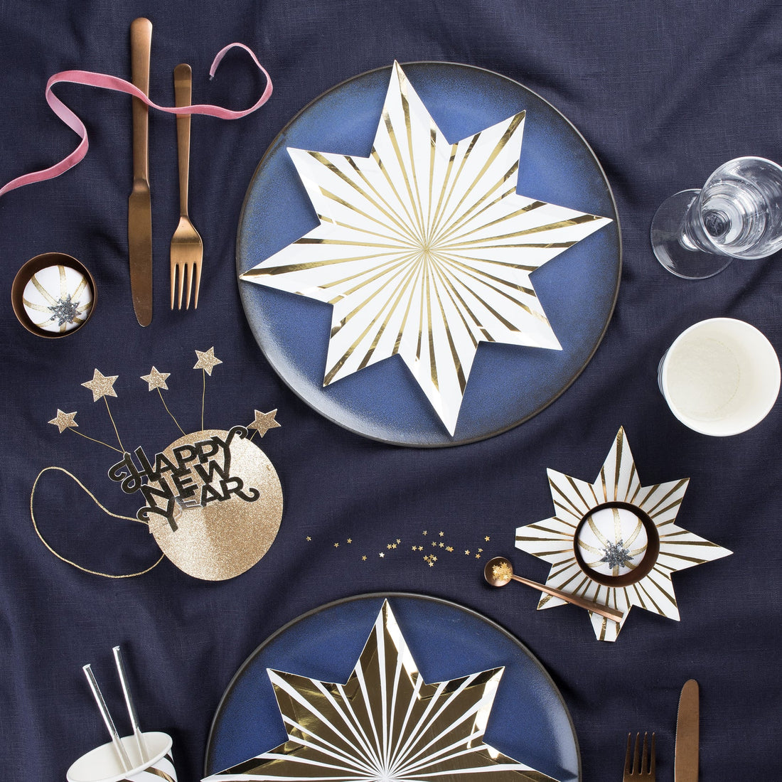 Two Meri Meri Gold Stripe Star Plates on a white background.