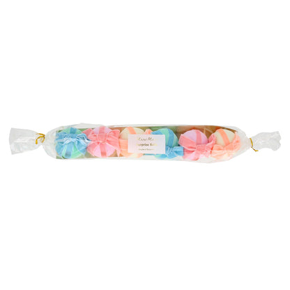 6 Surprise balls with big velvet ribbon bows in pink, peach and blue and wrapped in crepe paper layers of pale yellow, light pink and mint.