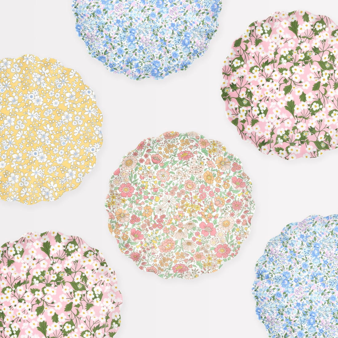 Meri Meri x Liberty melamine plates.  Each plate has a different Liberty print. 