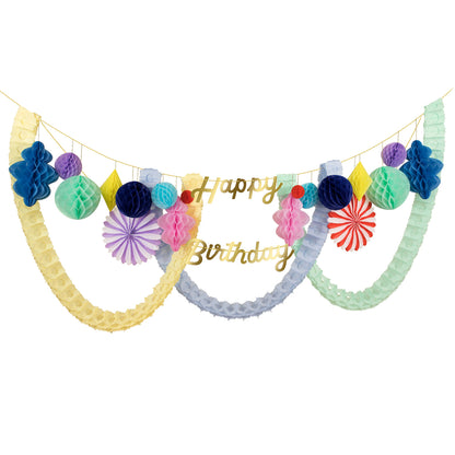 2 Garlands - one with the word Happy and the honeycomb pennants, and one with the word Birthday, both with gold cord and gold foil letters.  10 Honeycomb balls, ranging from 3 to 8 inches, in dark blue, mint, lilac, pale blue and coral red.