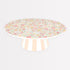 Meri Meri x Liberty Reusable Cake Stand with Liberty floral print in pinks, yellows and oranges on top and a pink and white striped base. 