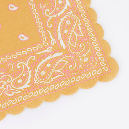 Close up edge of Meri Meri Western Bandana napkin in assorted colors. 