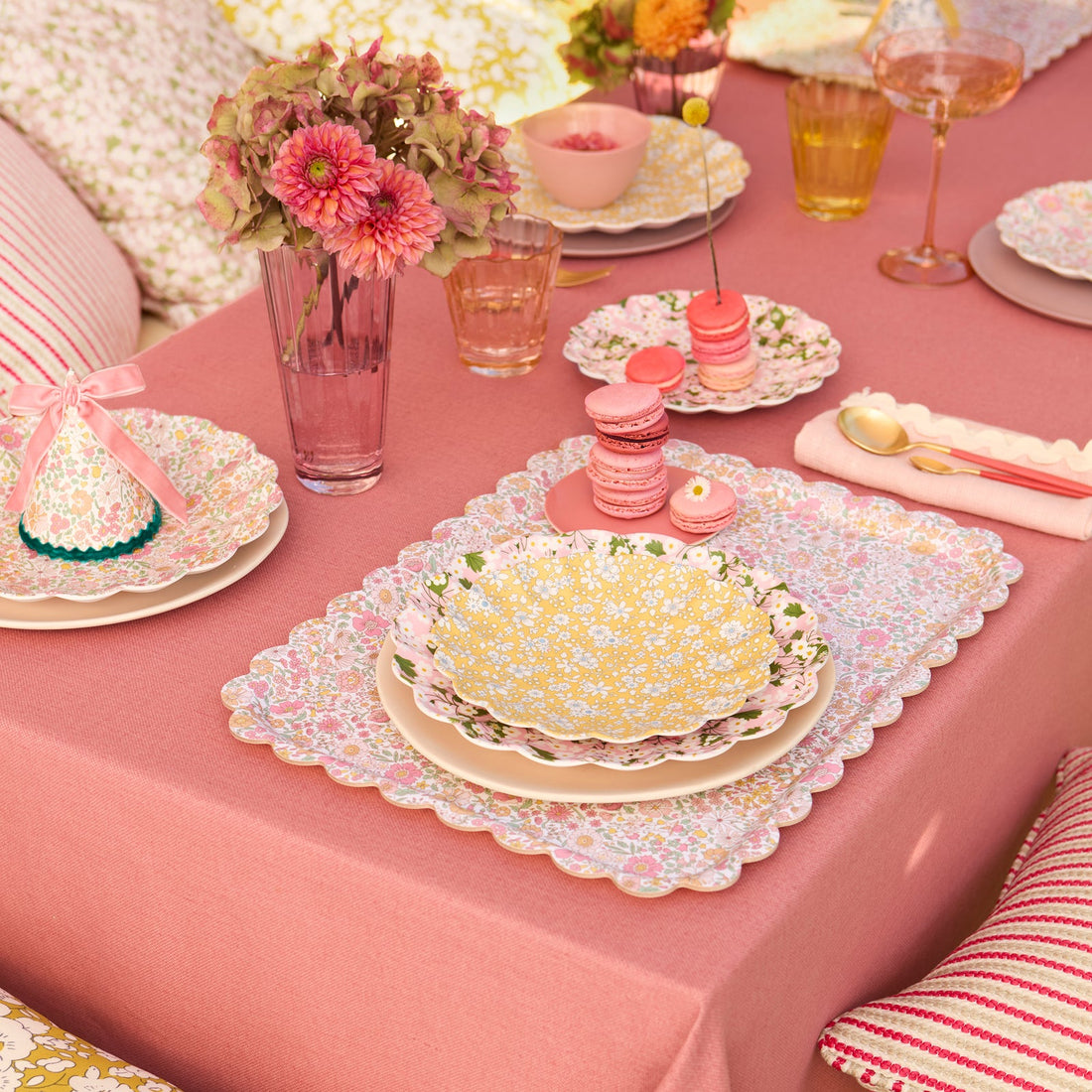 Lifestyle of Meri Meri x Liberty plate on a set table with flowers and macaroons. 