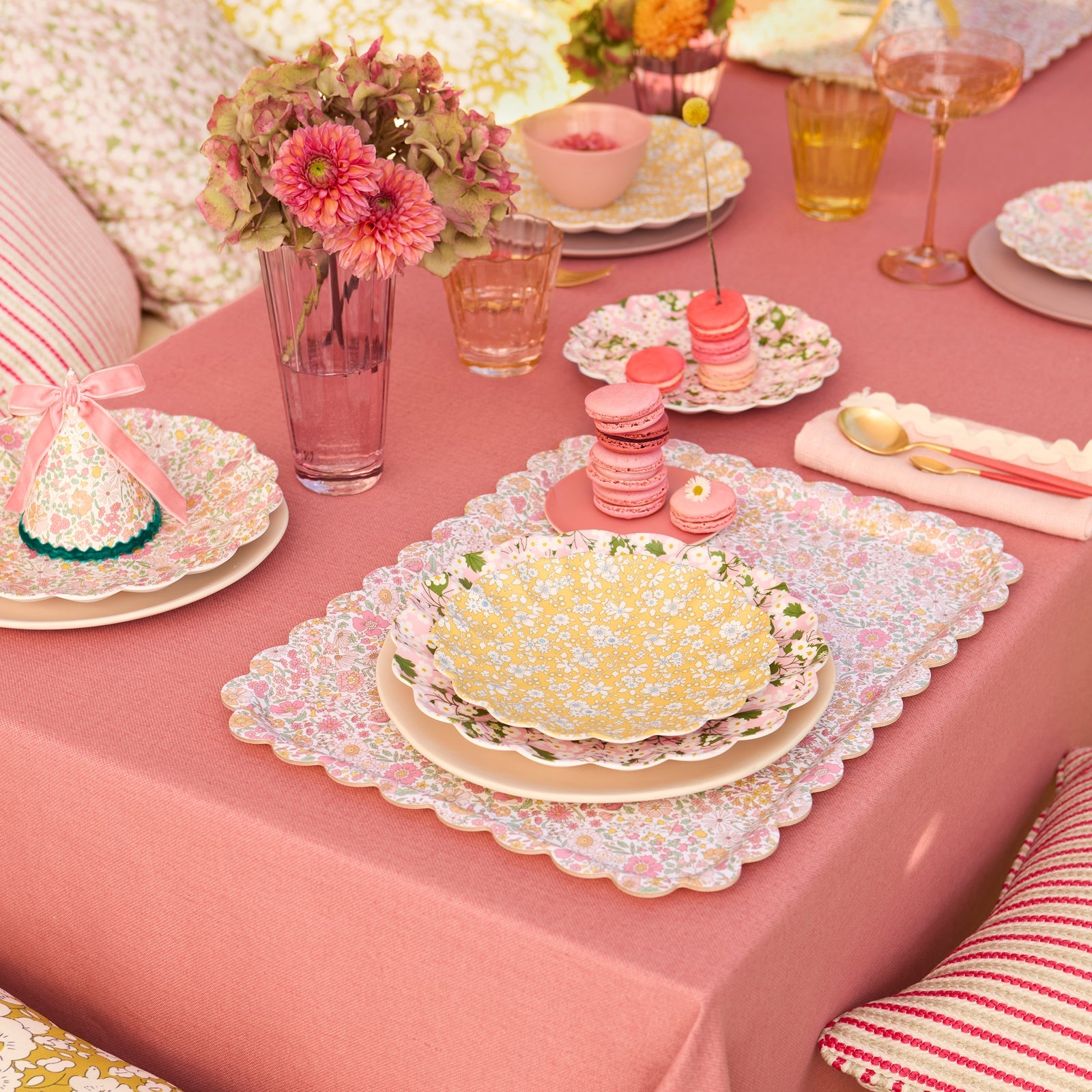 Lifestyle of Meri Meri x Liberty plate on a set table with flowers and macaroons. 